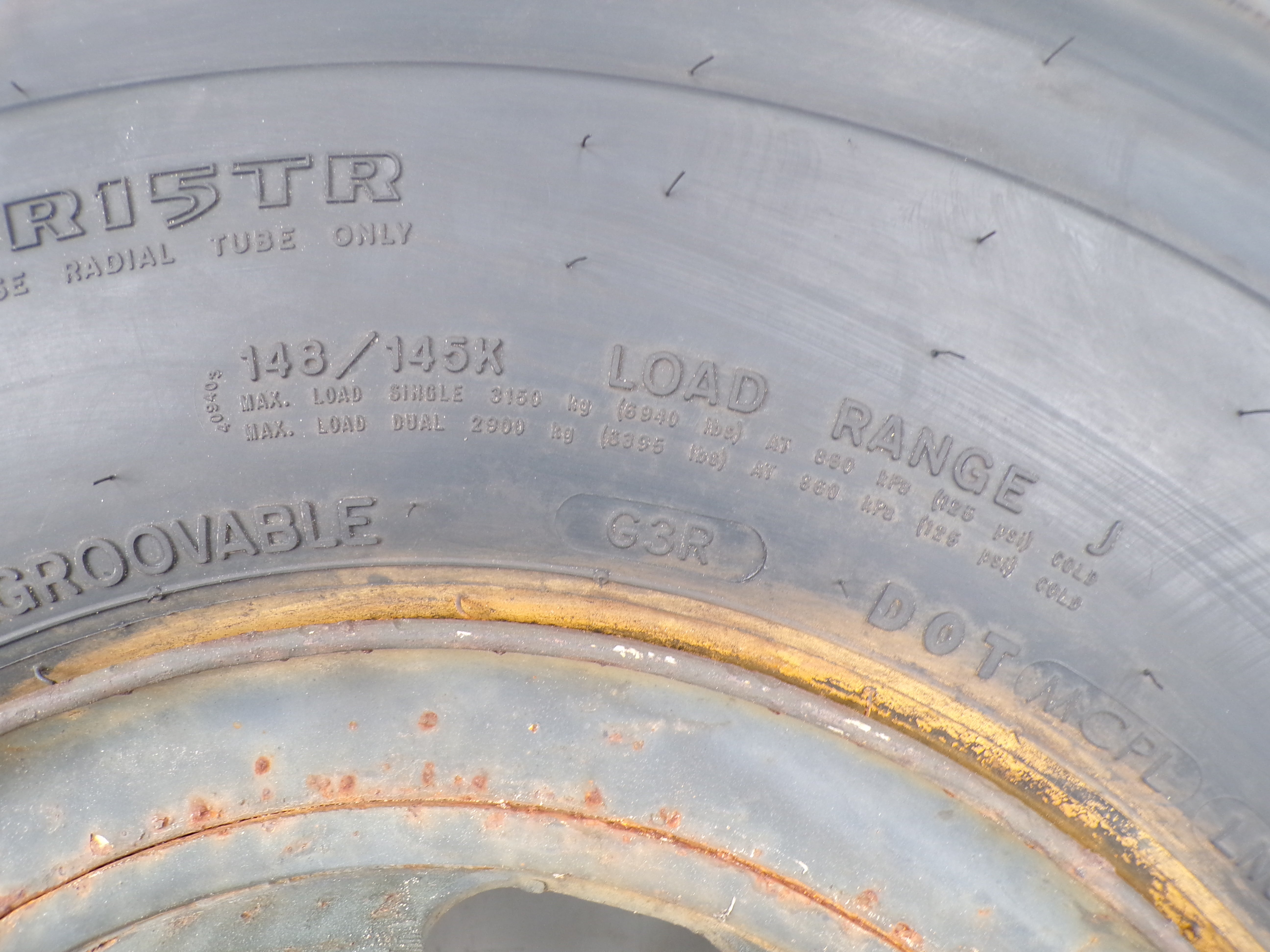 10.00R15 Goodyear G114 New on 6 hole used wheel