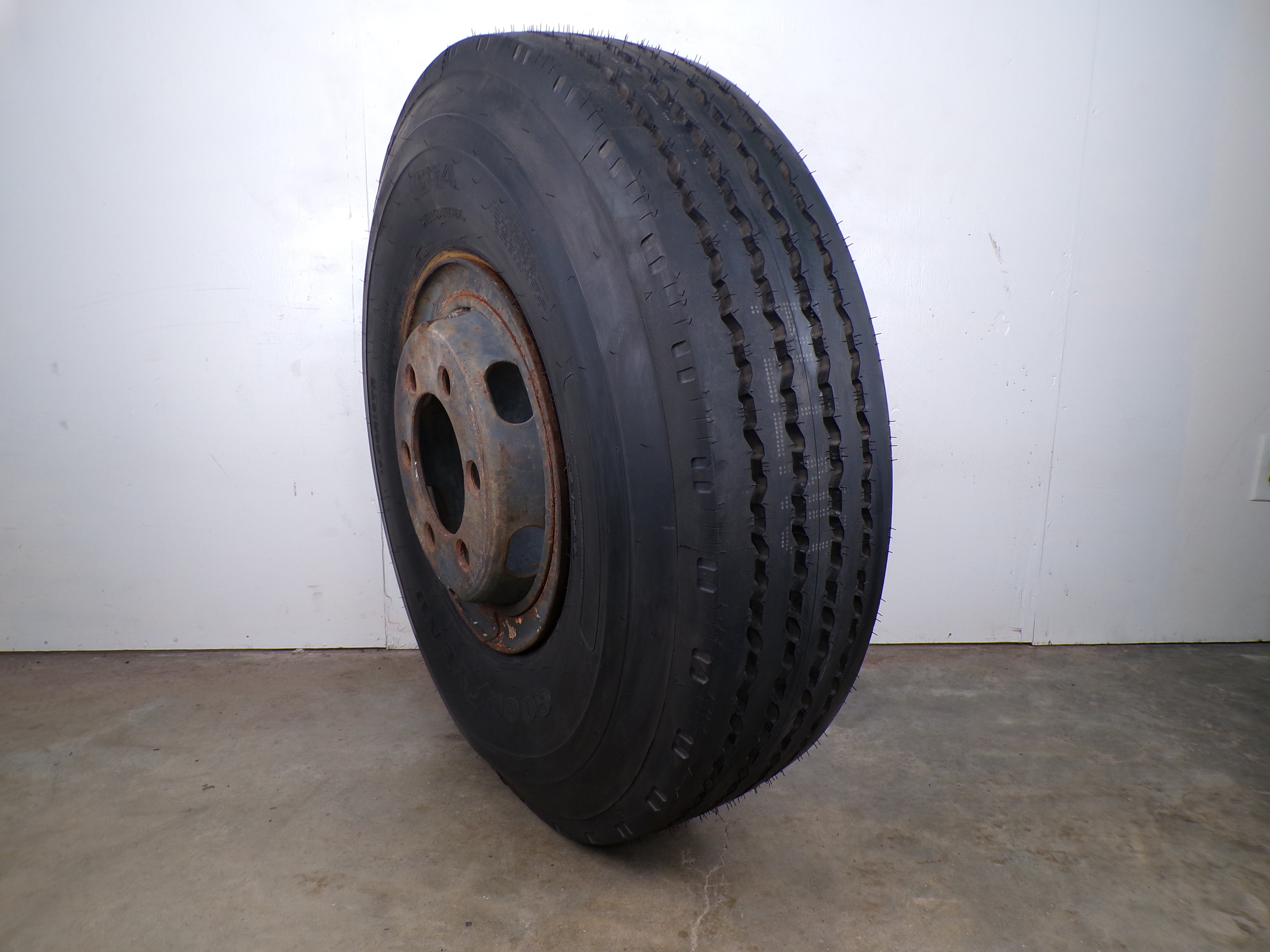 10.00R15 Goodyear G114 New on 6 hole used wheel